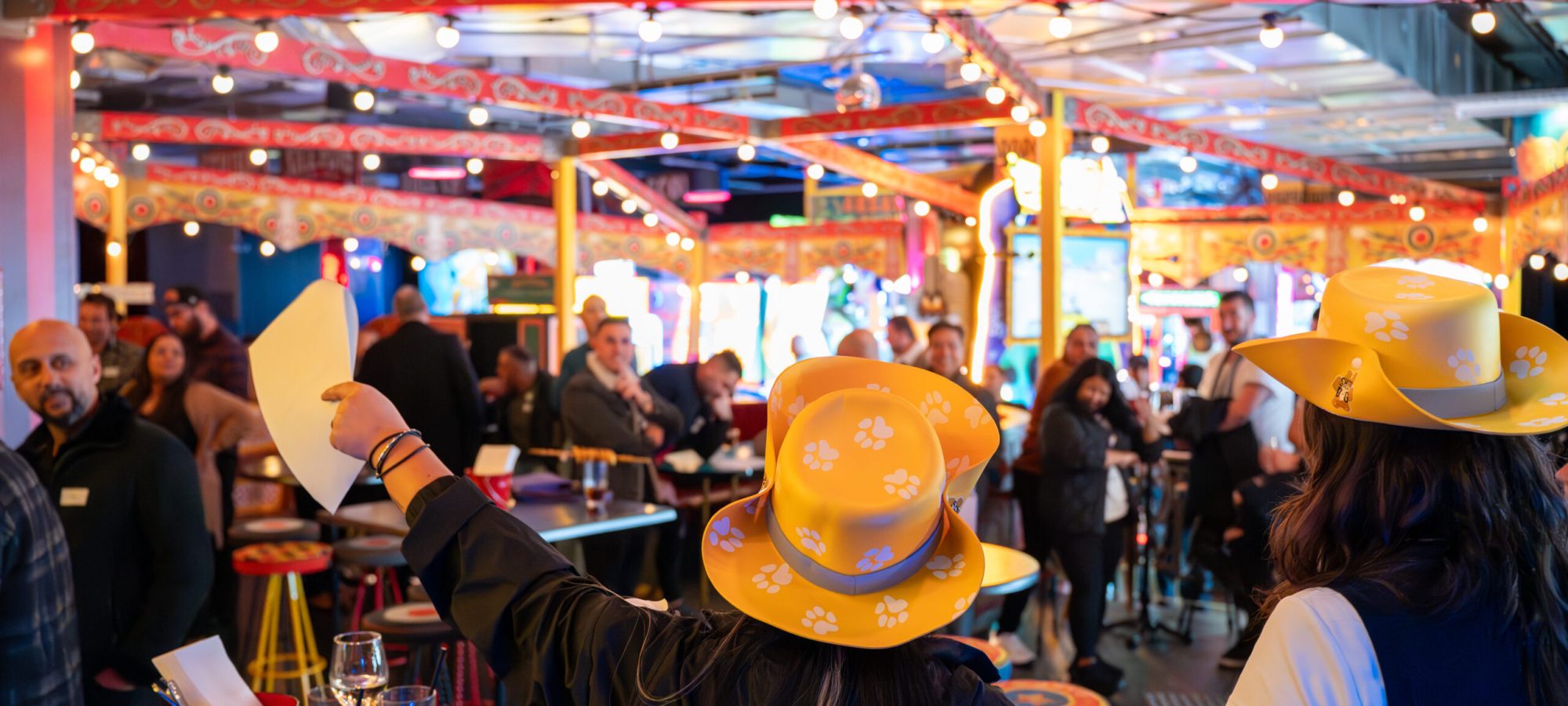 Candid photo of guests laughing and interacting during a Melbourne event