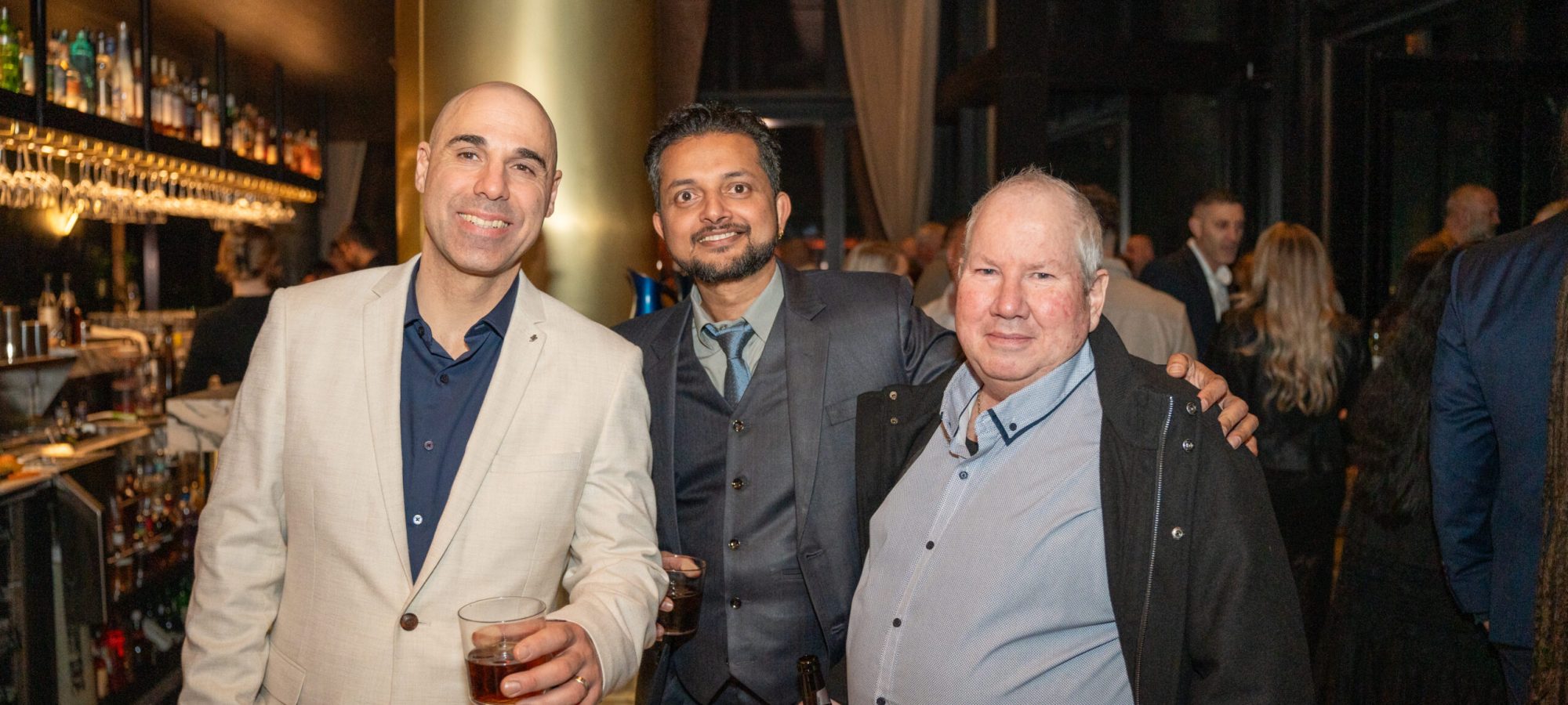 Guests posing stiffly at a Melbourne event, demonstrating what can ruin authentic event photos Melbourne