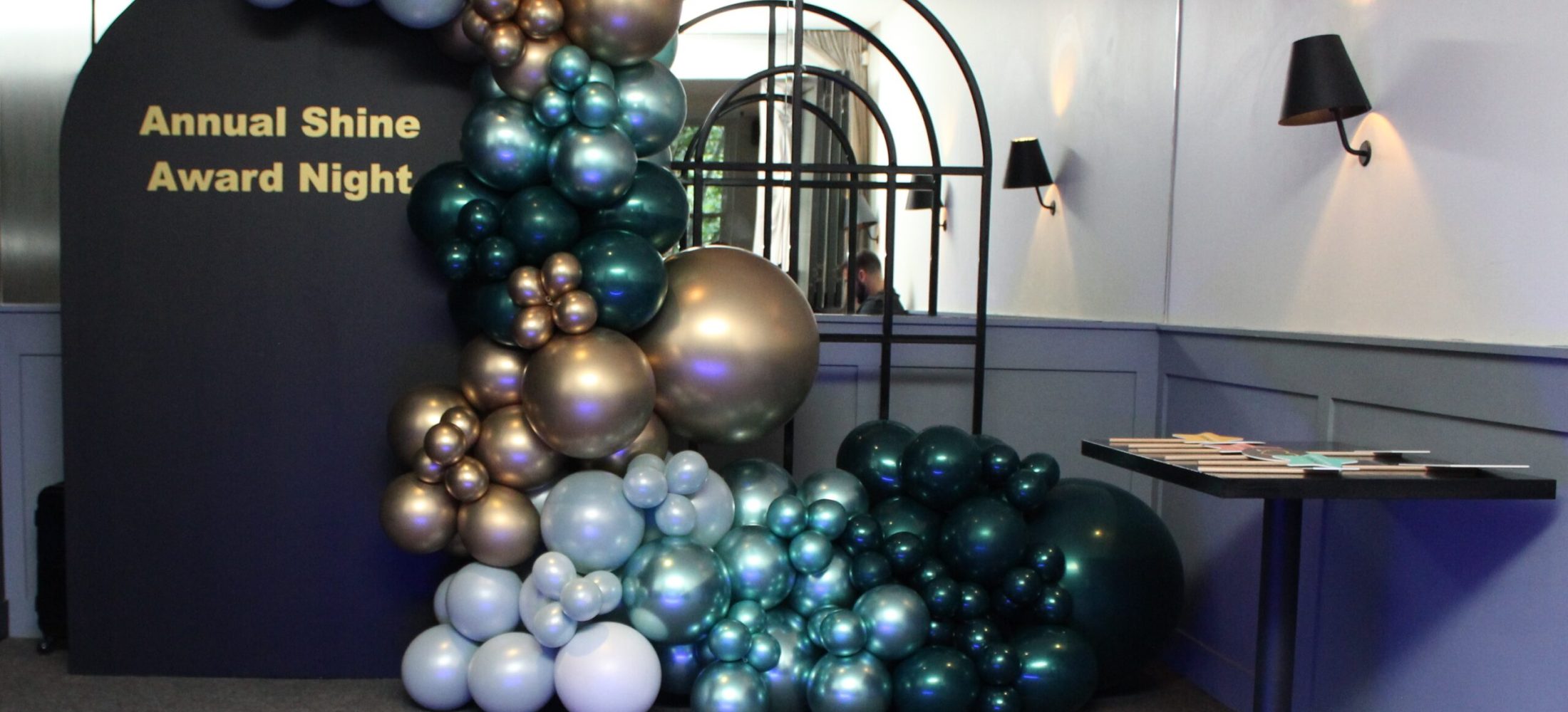 Photographer reviewing event setup to understand theme and atmosphere before shooting