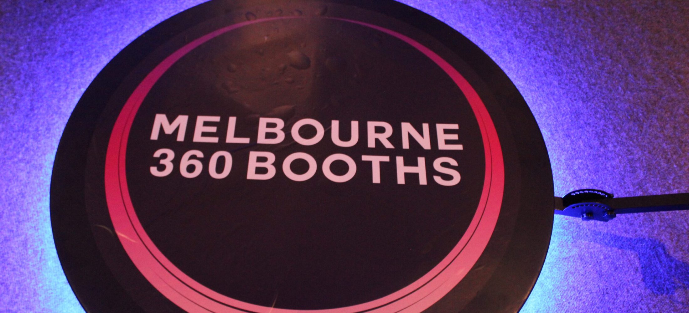 Candid moment of guests laughing during an event in Melbourne.